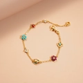Detail of gold chain necklace with colorful enamel ladybug and zircon flower charms - Multicolor
