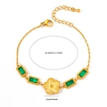 Gold plated stainless steel bracelet featuring green gemstones and a clover flower charm - Rectangular Green Zircon