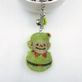 Green rhinestone character keychain with metallic bell and silk tassel accessory - Christmas Kid