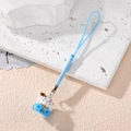 Japanese lucky cat bell charm with blue woven lanyard on a white stone background - Blue Blessing