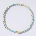 Handmade beaded bracelet with polished gold and light blue beads in a minimalist style - Pale Blue and Gold