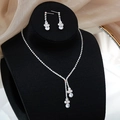 Elegant silver bridal jewelry set with teardrop zircon necklace and earrings on black display - GS014 Waterdrop Set / Silver