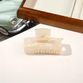 Detail of a pearlescent beige rectangle hair claw clip on a stylish aesthetic background - PVC 7.5cm Rectangular - Iridescent Yellow