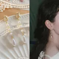 Elegant gold drop earrings featuring rectangle crystals and natural freshwater pearls - 26# Waterdrop Pearl Tassel Long Drop (Silver Needle)