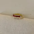 Detailed close-up of red enamel and zircon bamboo joint open ring on textured fabric - Style 5 Ring-Gold-Red-Bamboo (Bionic Design)