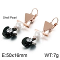Detail view of rose gold spiral earrings with shell pearls and black fan accents - Rose Gold + Black