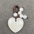 White heart-shaped crystal pendant on brown braided cord with matching round stone beads - Agate