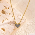 Minimalist gold heart pendant necklace with dark grey shell and beaded edge on stone - Necklace / Black Mother of Pearl
