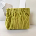 Detail of mustard green corduroy pouch with pleated texture and drawstring closure - No Label Plain / Green