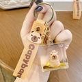 Creative Capybara oil-filled keychain with liquid glitter and orange silicone wristlet strap - Square Capybara - With Orange