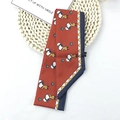Silky orange Snoopy cartoon hair scarf with geometric patterns and long ribbon style - Snoopy