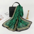 Green chiffon scarf with floral print and leopard border draped on a black handbag - Green (Vintage Leopard Edge)