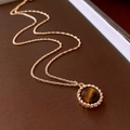 Close-up of golden rope chain necklace with round tiger eye stone pendant detail - Gold Twisted Edge Round Stone (24#)