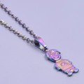Detailed close-up of a rainbow plated little girl shaped pendant on a stainless steel chain - Boy Necklace - Rainbow