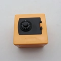 Yellow mini safe money box toy with a mechanical combination dial on the front - Orange