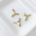 Detailed view of three 14k gold-plated whale tail charms for DIY jewelry making - 21# Whale Tail