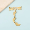 Detailed view of MOM letter pendant with heart stone and baby feet charms on stone - Gold Tone MOM with Triple Feet