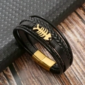 Dettaglio del bracciale in pelle nera multifilo con lisca di pesce d'oro e chiusura - Nero + Oro