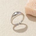 Macro view of bright silver adjustable open ring with a smooth polished arched surface - Adjustable Open / Shiny Silver Dome