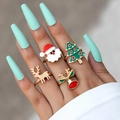 Christmas rings set of 4 with Santa and reindeer designs in festive enamel on a model hand - Christmas 4-Piece Set (20890)