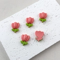 Detail shot of five pink resin tulip charms for DIY crafts on a textured white mat - 6# Light Pink Tulip