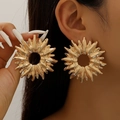 Elegant gold sunflower earrings with a radial design worn by a model in a close-up shot - Gold Large Irregular Sun Earrings (DZ-274)
