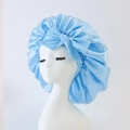 Light blue satin sleep bonnet with a large bow decoration for hair care - Medium Single Layer Ribbon / Light Blue