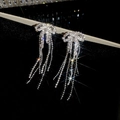 Sparkling silver bow earrings with rhinestone tassels and starburst light effects - Bow Rhinestone Tassel Earrings (54#)