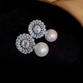 Macro detail of gold plated flower stud earrings with marquise crystals and pearl drops - Silver Flower Pearl (24# Silver Needle)