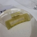 Glossy transparent lime green square hollow claw clip for women on a ceramic dish - Square Glossy Green
