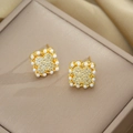 Golden clover earrings featuring pearls and sparkling diamonds for elegant women - Stud Earrings