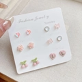 Set of seven pink and white floral stud earrings on a daily organizer display card - ZS6 Pink Cherry / 7 Pairs Set