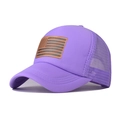 Detail of purple breathable mesh trucker hat featuring a brown leather US flag patch - Light Purple