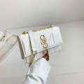 White quilted crossbody bag with gold S-buckle, fringe tassel and elegant chain strap - White