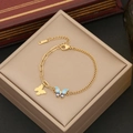 Golden stainless steel butterfly charm bracelet with evil eye enamel detail on a jewelry box - Butterfly Evil Eye Style (1#)