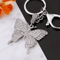 Sparkling silver butterfly keychain with crystal rhinestones on marble background - Full Rhinestone Silver Butterfly