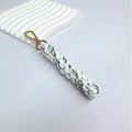 Handmade woven key charm in white and black rope with elegant golden lobster clasp - White