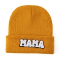 Close-up of bright yellow knitted beanie featuring white MAMA towel embroidery - Earthy Yellow