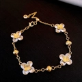 Gold chain bracelet with four-petal crystal flowers and adjustable lobster clasp - Gold