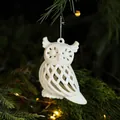 White hollow owl Christmas tree ornament with glitter finish hanging on a green branch - Owl/1 Pack