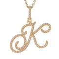 Macro shot of gold-plated letter K pendant with micro-paved sparkling cubic zirconia - K (Gold)