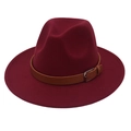 Close-up of burgundy fedora hat with brown leather belt buckle and wool felt texture - Burgundy
