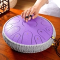 Purple steel tongue drum with decorative rope being played by hand with finger picks - 13 Inch 15 Notes - Snow Purple - Maple Leaf