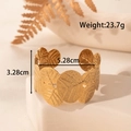 Adjustable wide leaf-shaped stainless steel open cuff bracelet in golden finish - Leaf