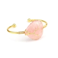 Detail of handmade gold wire-wrapped heart-shaped pink crystal tree of life bangle - Rose Quartz