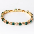 Detailed view of single row 6mm emerald and white zircon tennis bracelet in gold plating - White & Green Zircon Gold
