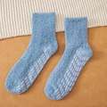 Blue coral fleece socks with anti-slip grip sole on cozy white knit background - One Size / Denim Blue