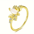 Detailed close-up showing marquise gemstone and cubic zirconia pavé on golden moon ring - US 5 / Gold