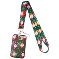 Dettaglio del cordino natalizio e porta badge con motivi di Babbo Natale su nastro verde - Babbo Natale verde scuro (Set)