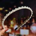 Macro shot of hand-held pearl braided headband featuring elegant white faux pearls - S271-3 Elegant Lady Style Pearl Densely Paved